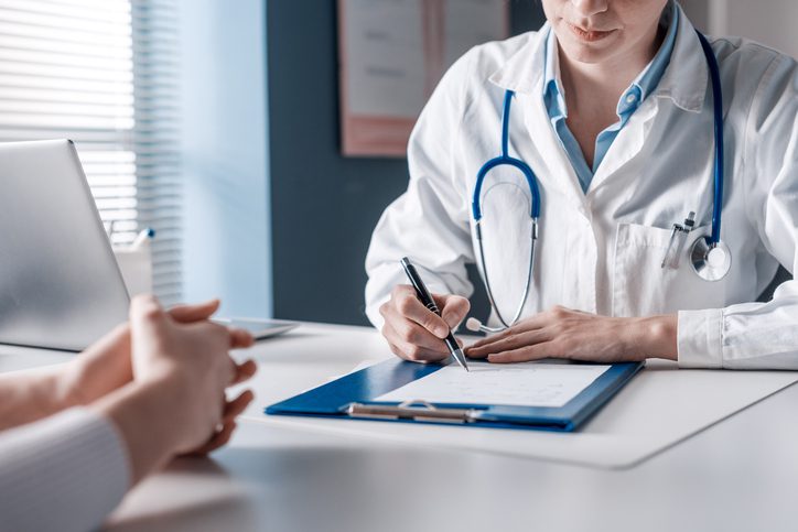 Doctor writing a medical prescription Doctor writing a medical prescription